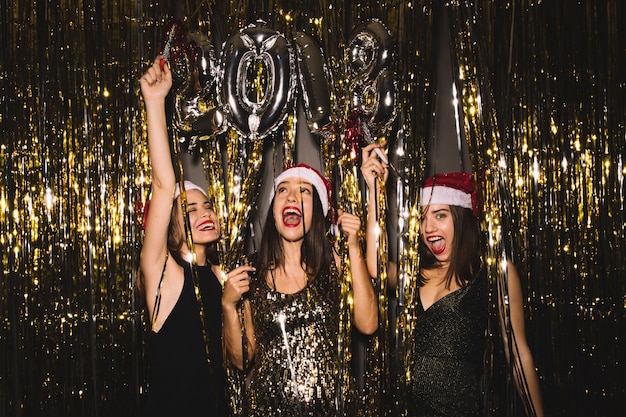 2018 new year party with three girls dancing