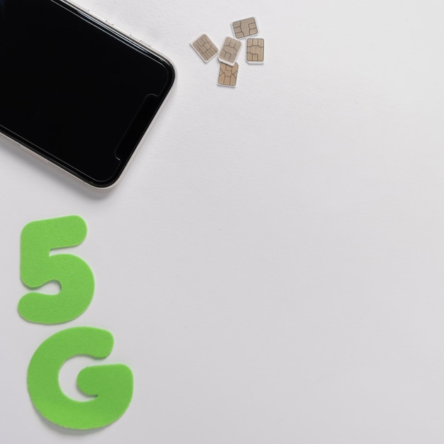 Free Photo 5g spelled out under mobile phone