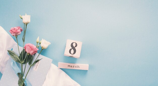 8 March inscription with roses on table