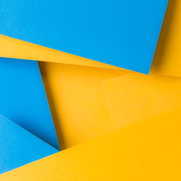 Free photo abstract background of blue and yellow texture paper backdrop