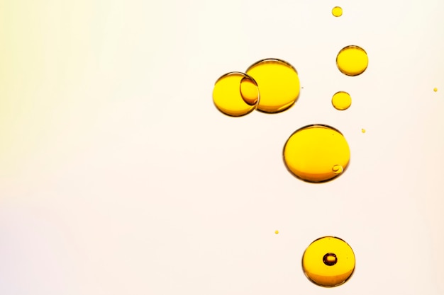 Free photo abstract background yellow oil bubble in water wallpaper