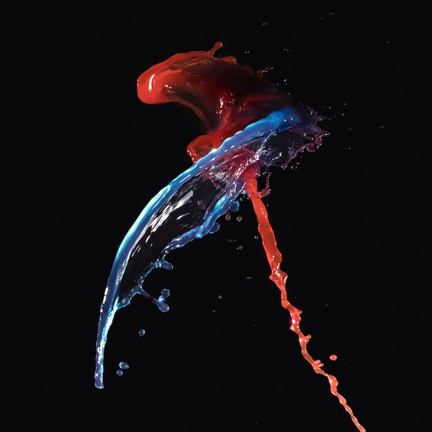 Free photo abstract blue and red liquid splashing on black backdrop