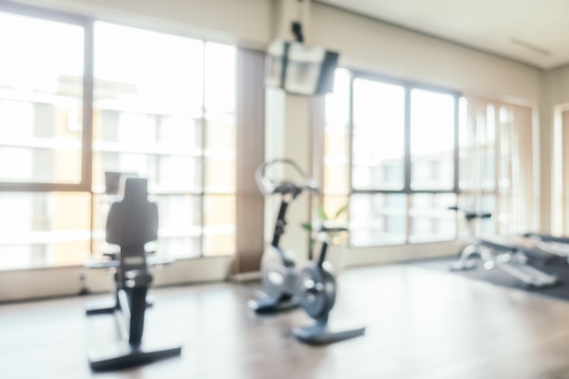 Abstract blur fitness equipment in gym room interior