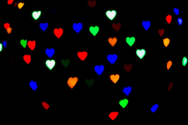 Free photo abstract bokeh background with heart shaped lights