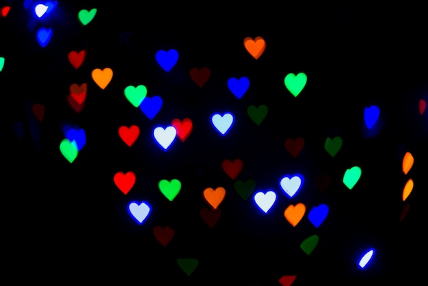 Abstract bokeh background with heart shaped lights