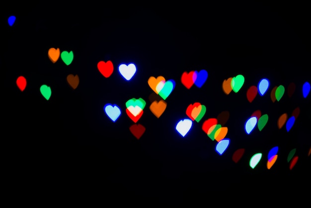 Free photo abstract bokeh background with heart shaped lights