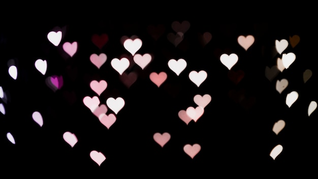 Free photo abstract bokeh background with heart shaped lights