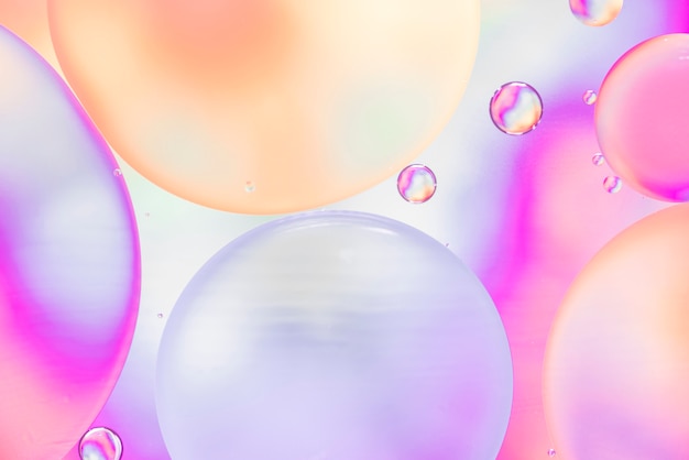 Free photo abstract bubbles on hued blurred background