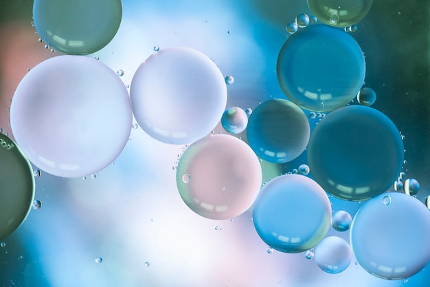 Free Photo abstract bubbles on multicolored blurred background