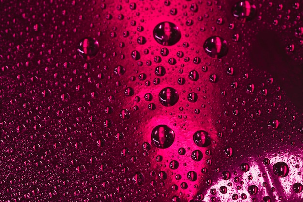 Free photo abstract burgundy background with water drops