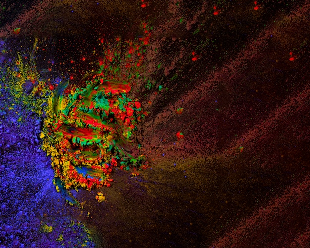 Abstract colored dust explosion on black background