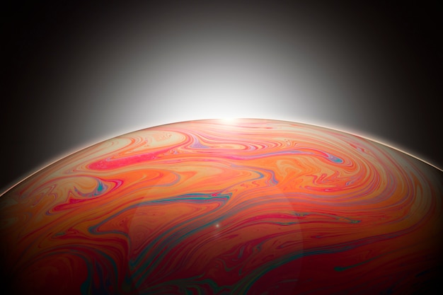 Abstract colorful soap bubble on black background