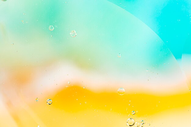 Abstract coloured background with variety of transparent raindrops