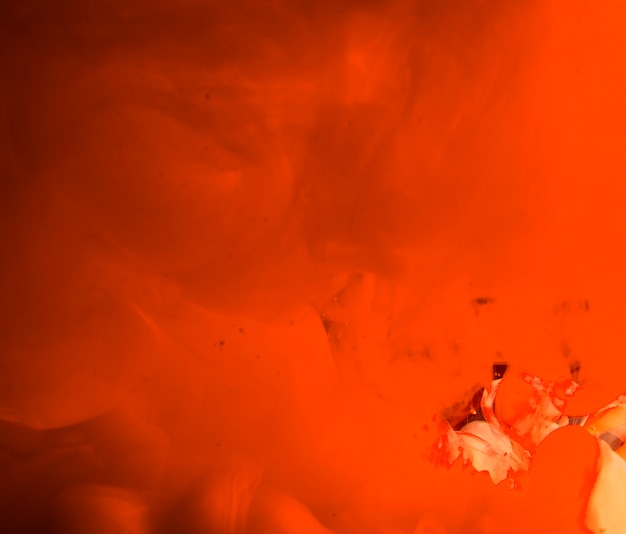 Abstract dense orange waving smoke