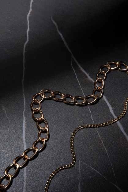 Free photo abstract gold chain jewellery presentation