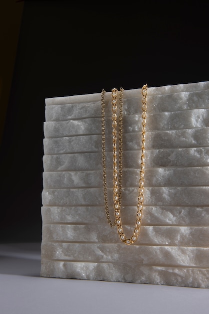 Abstract gold chain jewellery presentation