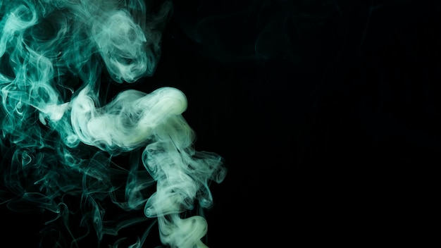 Free photo abstract green smoke move on black background