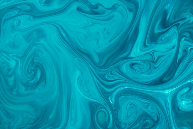 Free photo abstract hand drawn blue fluid background