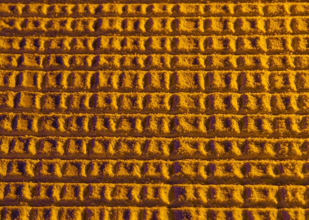 Free photo abstract honeycomb with yellow sand