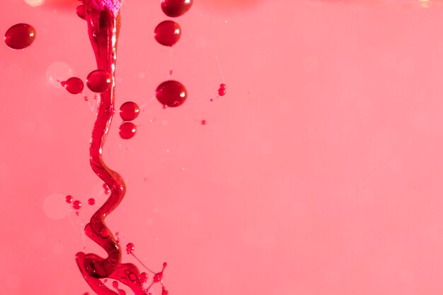 Abstract liquid slime on pink surface