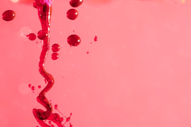 Abstract liquid slime on pink surface