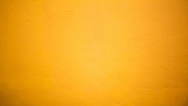 Free photo abstract luxury clear yellow wall well use as backdrop,background and layout.