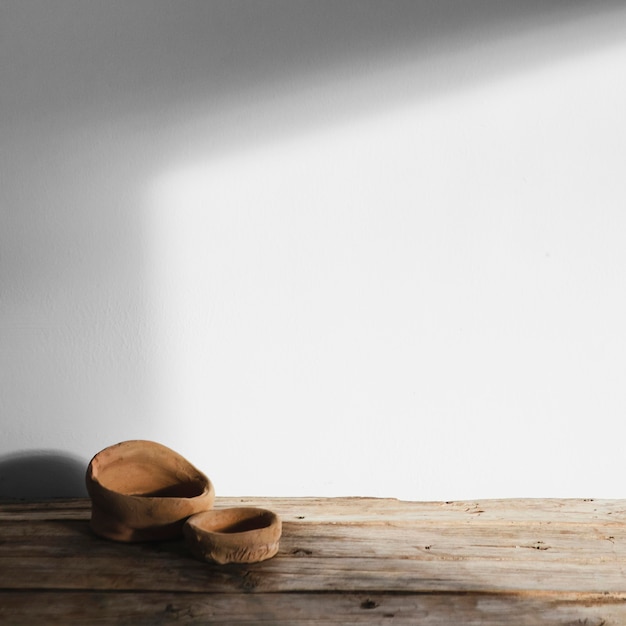 Free photo abstract minimal concept objects with shadows on wooden table