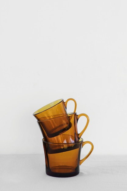 Free photo abstract minimal kitchen objects cups front view