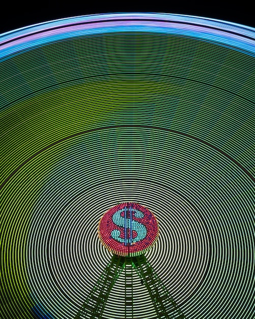 Free Photo abstract neon light waves of wonder wheel and dollar sign