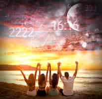 Free photo abstract numerology concept with friends at beach