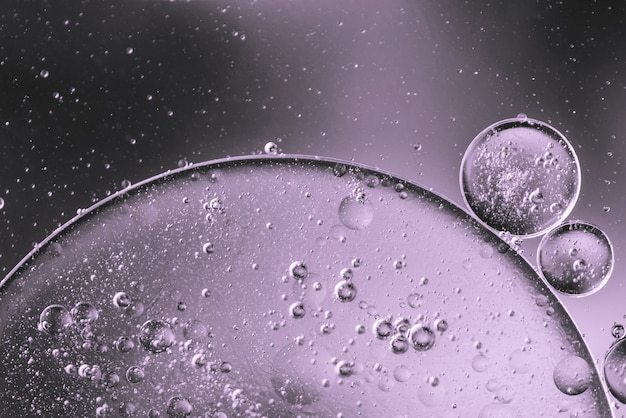 Abstract oil drops in water on blurred black and white background