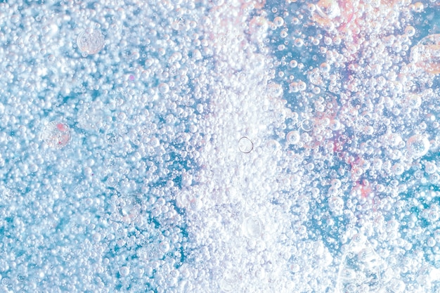 Free photo abstract oil with blue sparkles