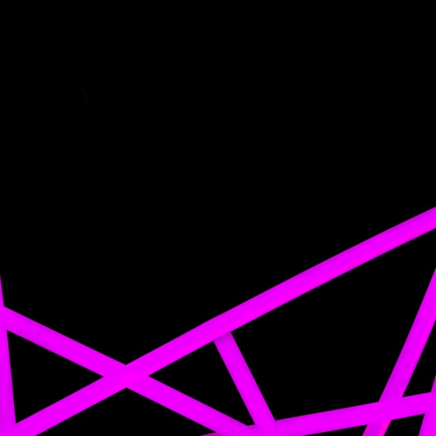 Abstract pink neon light line on backdrop