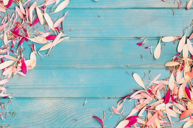 Free photo abstract pink petals on wooden table