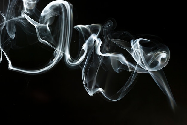 Free photo abstract smoke shape on dark background