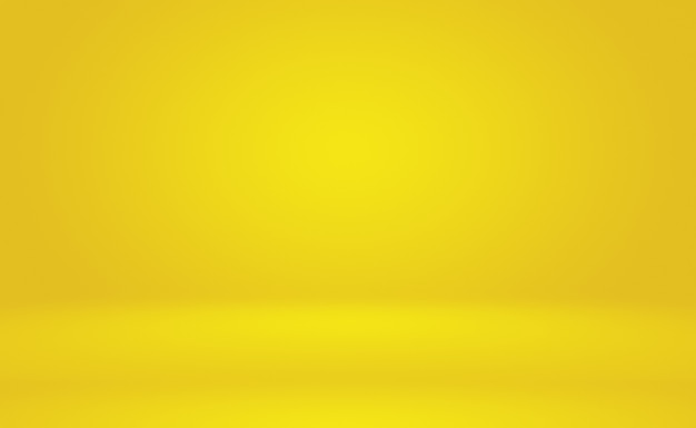 Free photo abstract solid of shining yellow gradient studio wall room background.