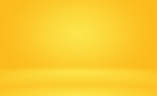 Free photo abstract solid of shining yellow gradient studio wall room background.