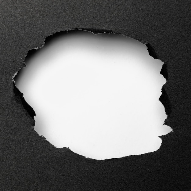 Free Photo abstract white cutout shape on black background