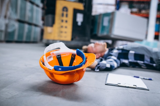 An accident at a warehouse, man on floor