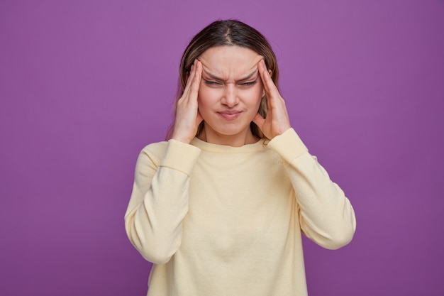 Free Photo aching young girl keeping hands on head 