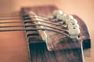 Free photo acoustic guitar bridge and strings close up