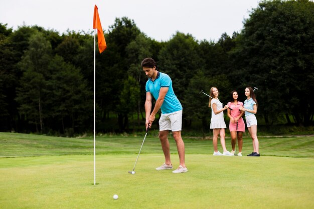 Active adult man playing golf 