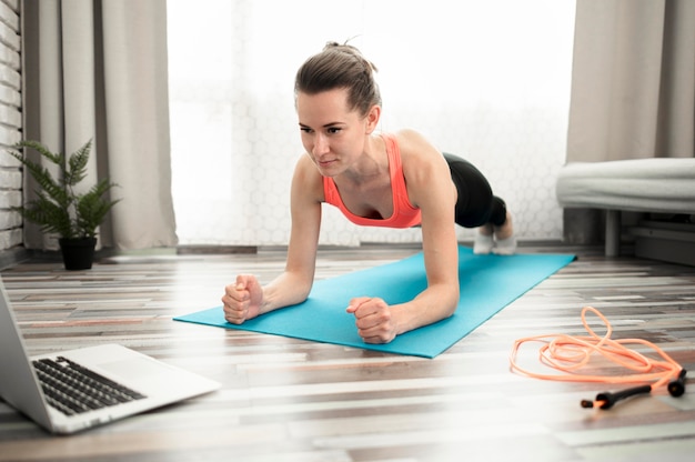 Active woman exercising athome