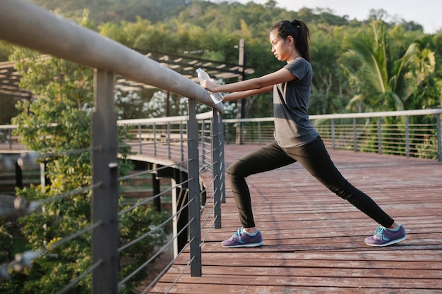 Active woman stretching outdoors