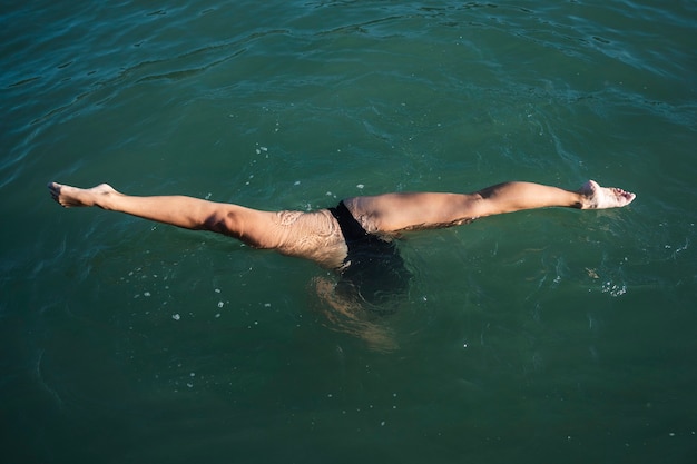 Free photo active young lady enjoying swimming