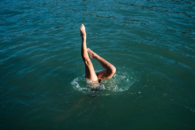 Free photo active young lady enjoying swimming