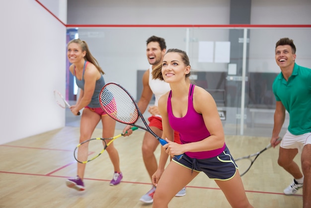 Free photo active young people playing squash