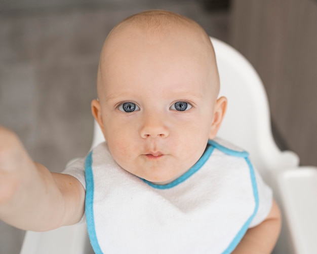 Adorable baby playing with food