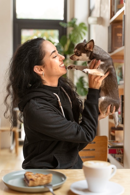 Adorable chihuahua dog with female owner