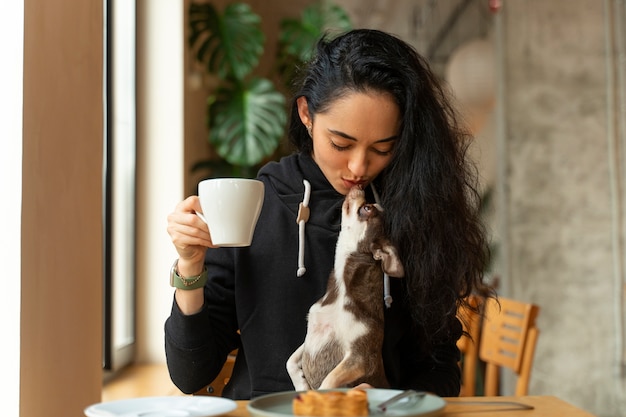 Adorable chihuahua dog with female owner